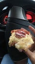 Pizza while drive Royalty Free Stock Photo